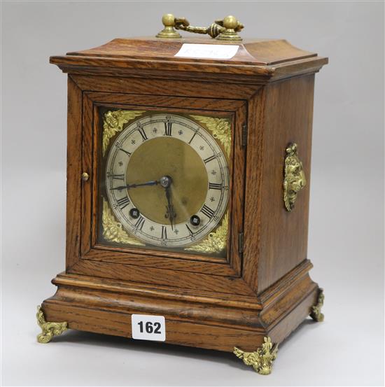 An Edwardian oak cased mantel clock height 29cm